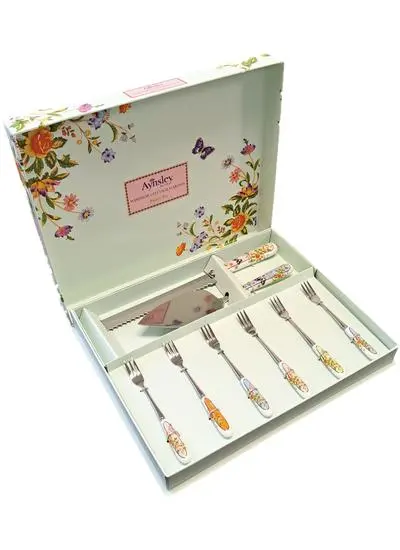 The Aynsley Pastry Set including a knife, six forks and a cake knife rest inside a mint-colored box decorated with butterflies and flowers. 